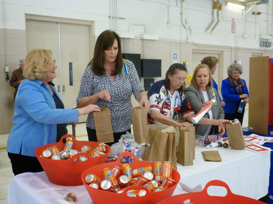 Women filling bags with treats
