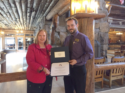 Regent presenting certificate to manager at Old Faithful Inn